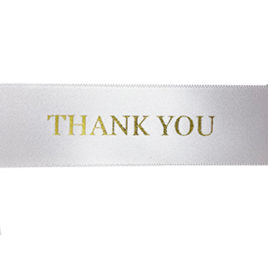 white ribbon with gold Thank you text